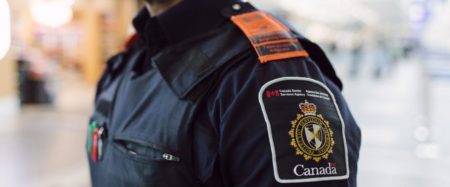 Photo of CBSA officer with orange epaulettes