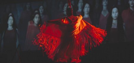 image of an Indigenous dancer wearing a red dress