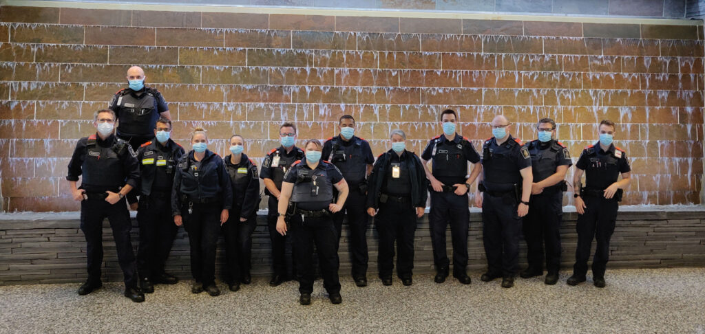 Calgary Airport Border Officers wearing orange epaulets in solidarity